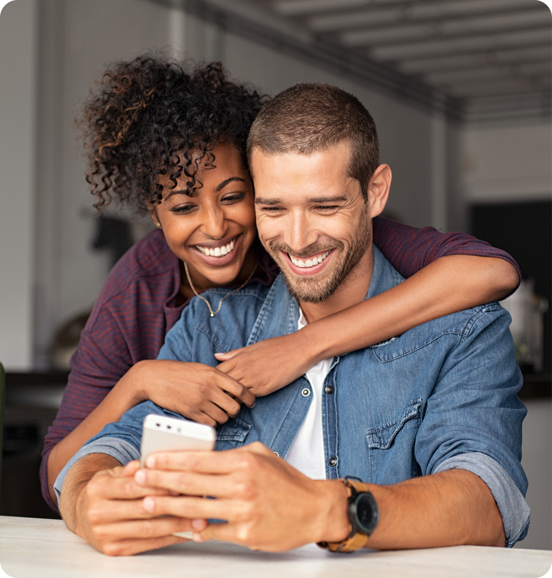 Couple looking at phone together